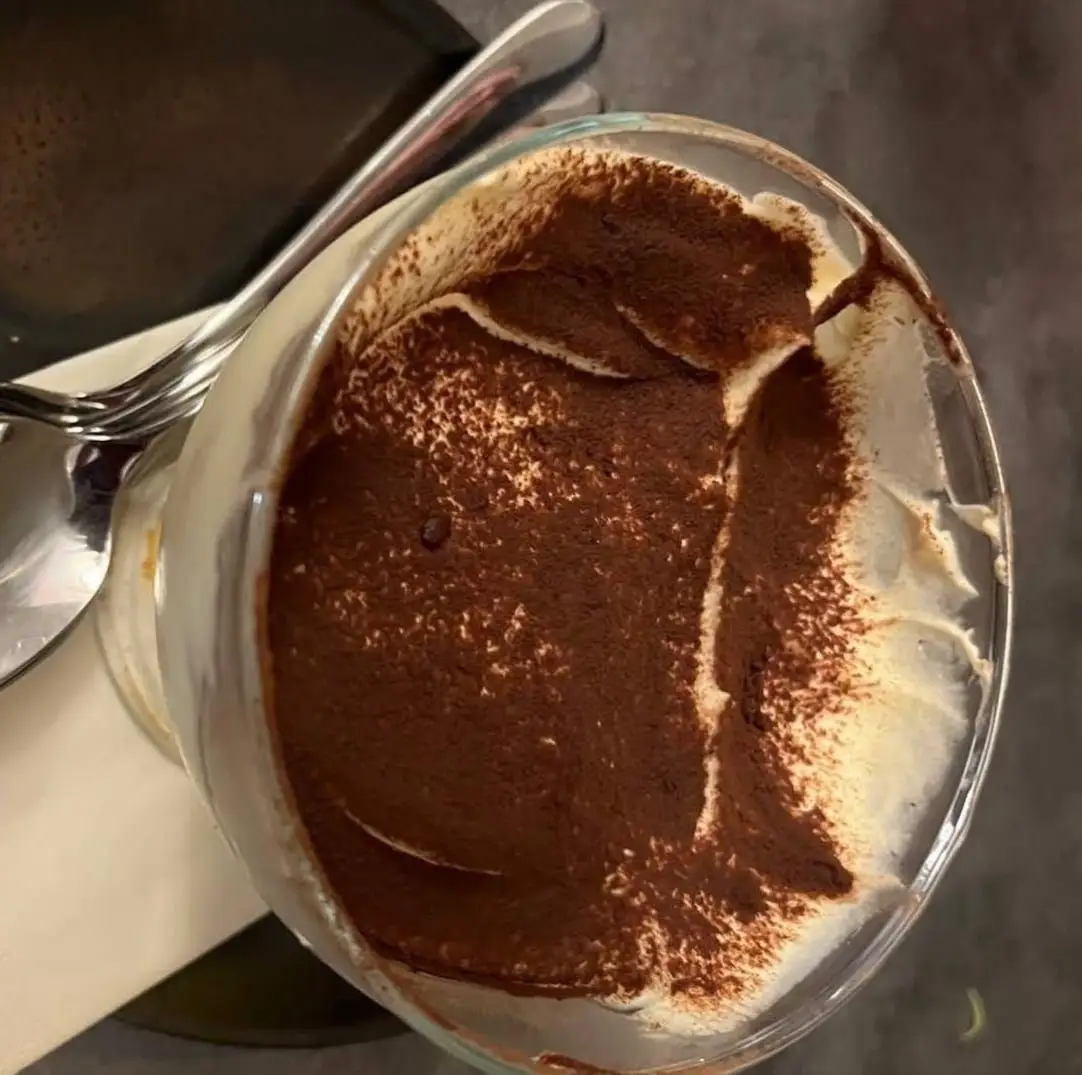 Tiramisù in a glass, dusted with cocoa