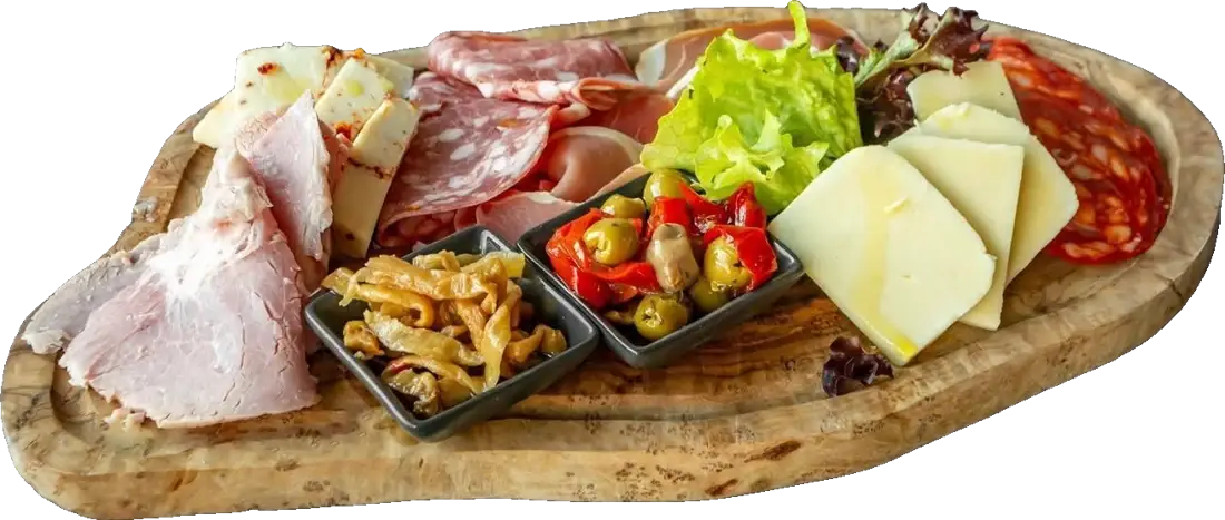 A board of Italian salumi and cheeses with pickled peppers